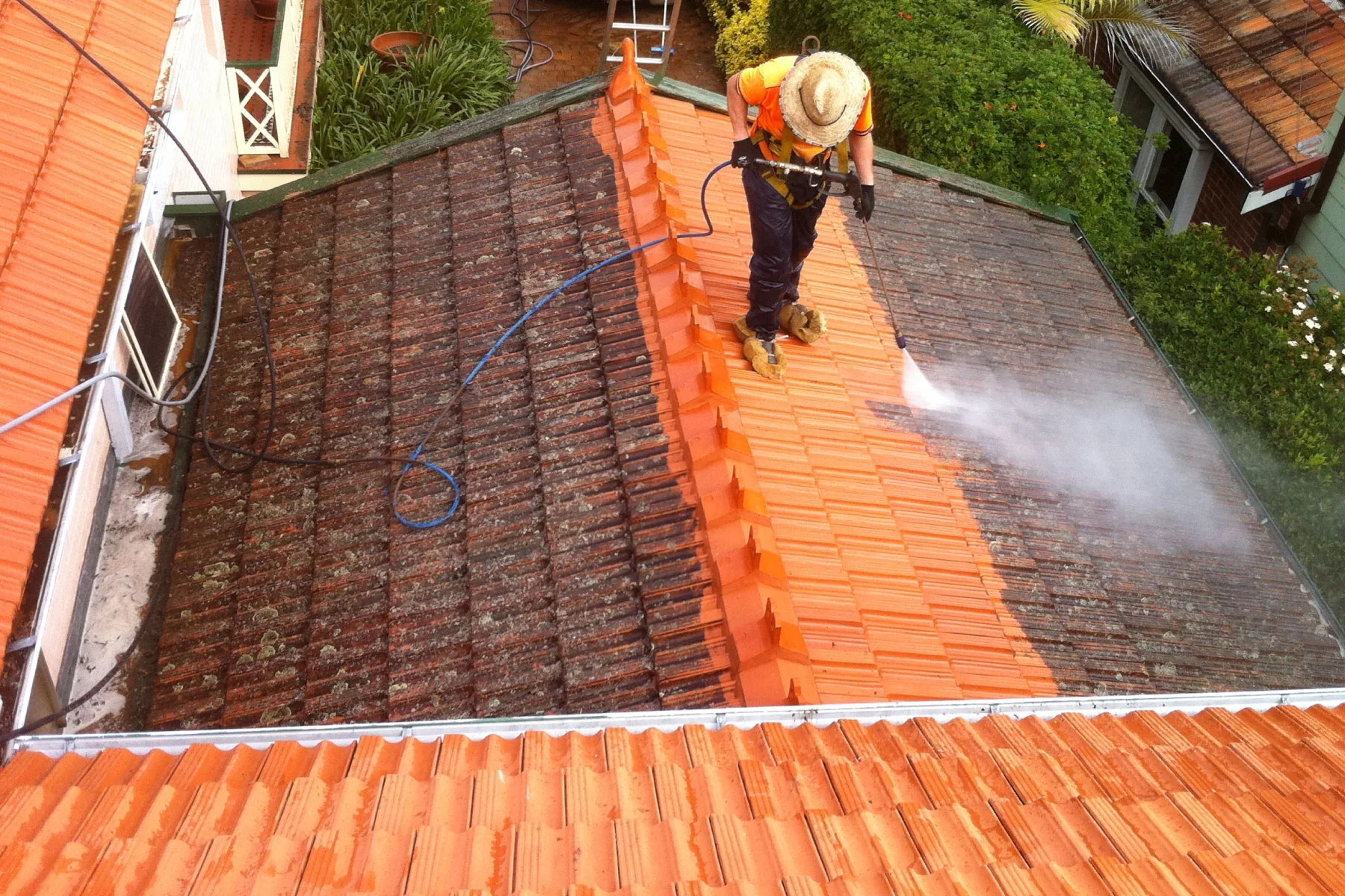 Man cleaning a roof